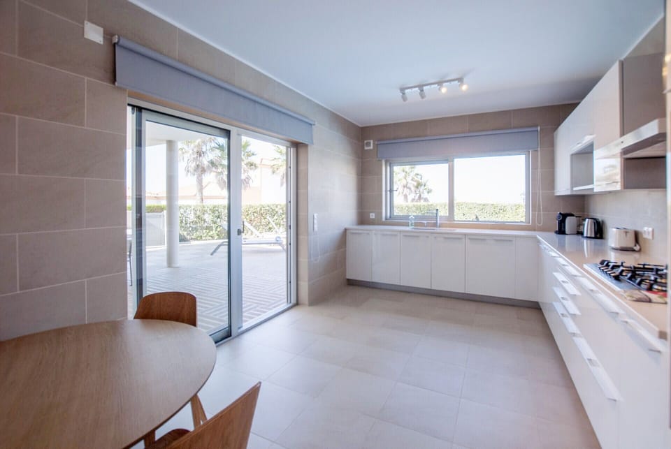 Spacious kitchen with access to the outdoor area.