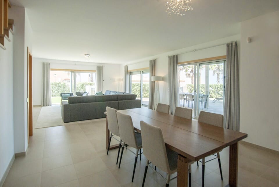 Open space living room with dining room with natural light.