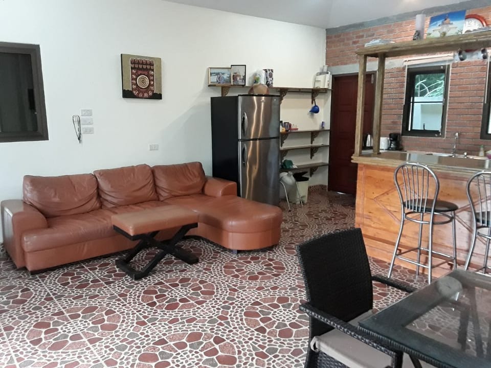 Bedrooms lead off each side of kitchen, sitting room. Internal Dining table.