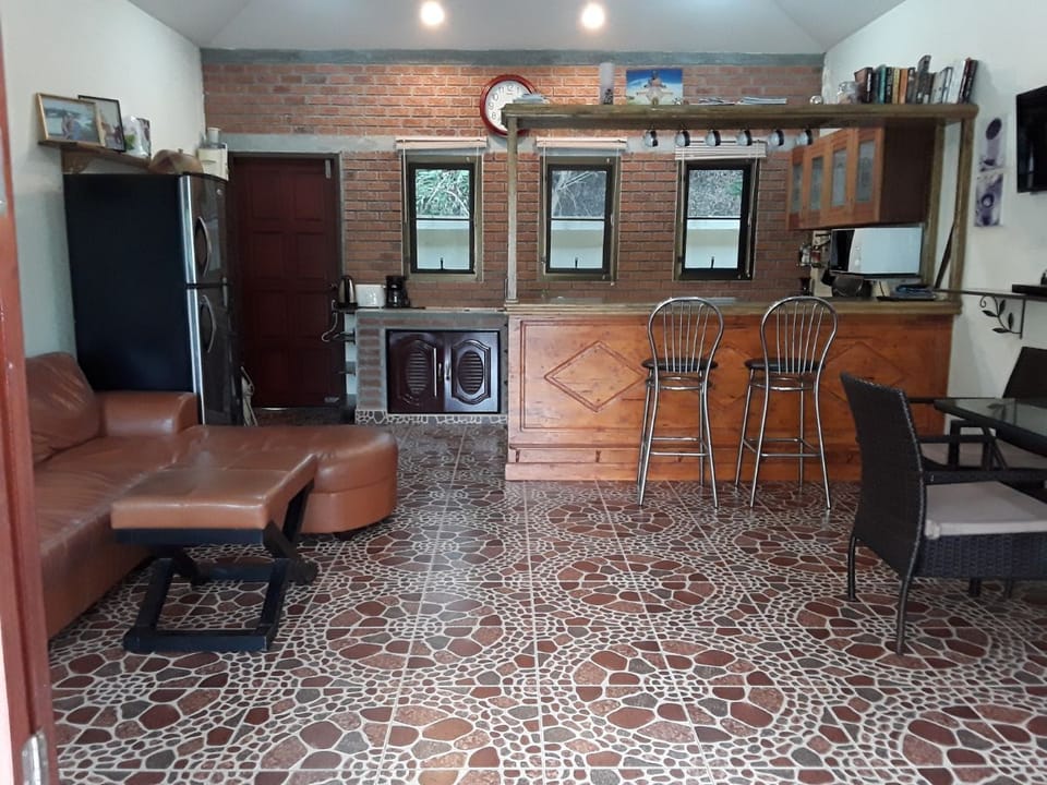 Central kitchen/living room. Full size oven, fridge, freezer, microwave etc.