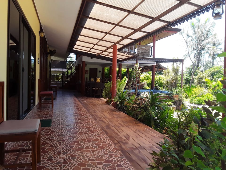 Shady veranda in front of bedrooms and living room/kitchen.