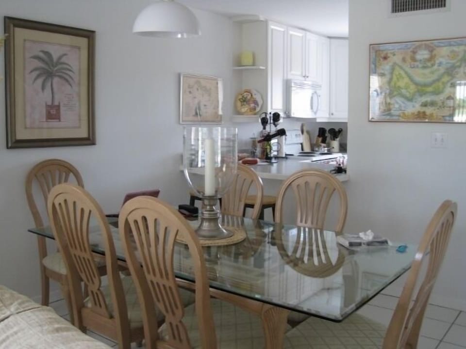 formal dining table and view of kitchen and breakfast bar