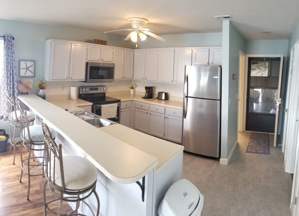 Kitchen with bar stool seating.