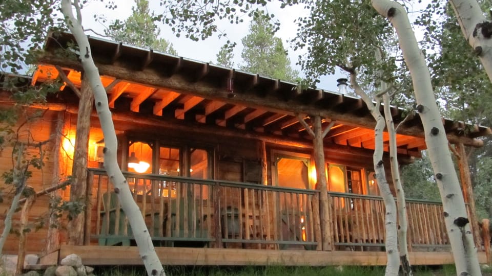 Evening glow on the front porch on a summer evening at Box Creek Cabin!