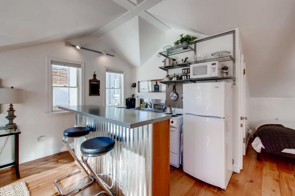 Fully equipped kitchen w/mid-sized refrigerator, Keurig, stove, and microwave.