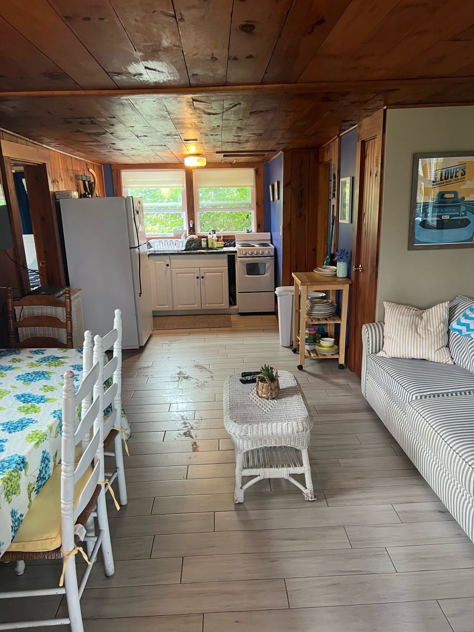 Living room open to kitchen/dining area w AC (sorry floors still drying in pic!)