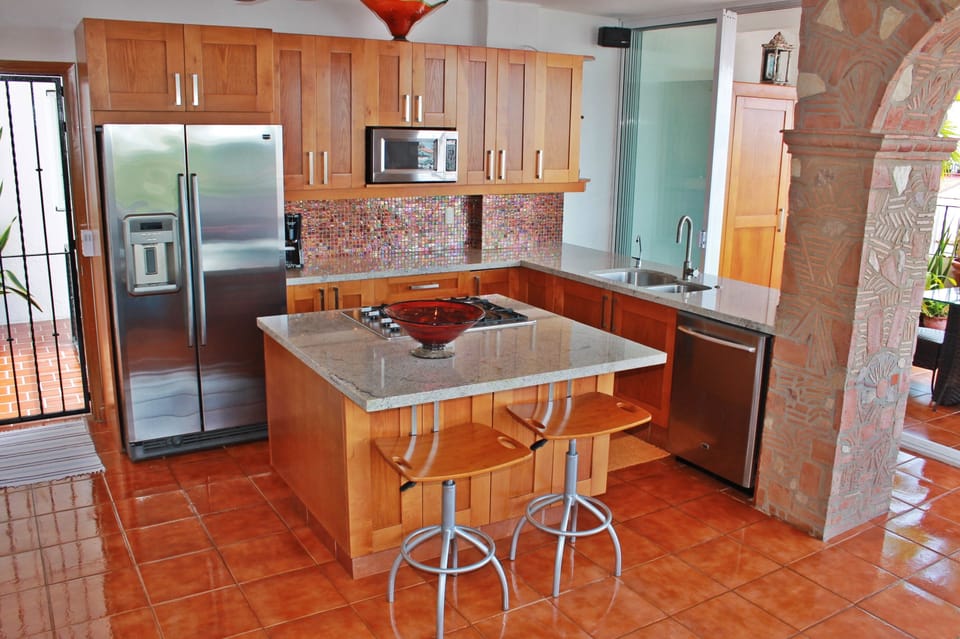 Kitchen w/all the utensils, pots, and pans you would ever need.