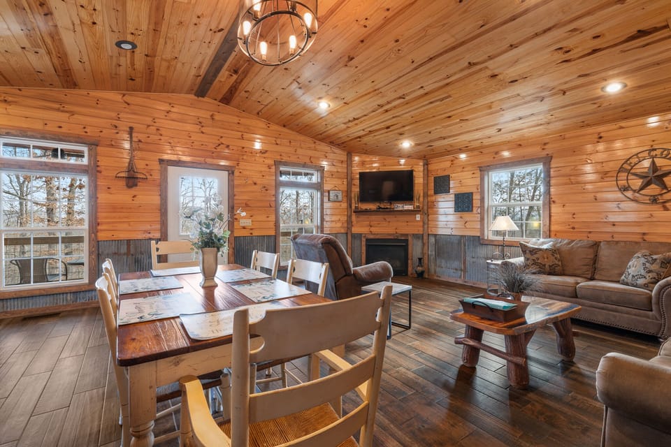 Open floor plan with50 inch roku tv, gas fireplace and sleeper sofa