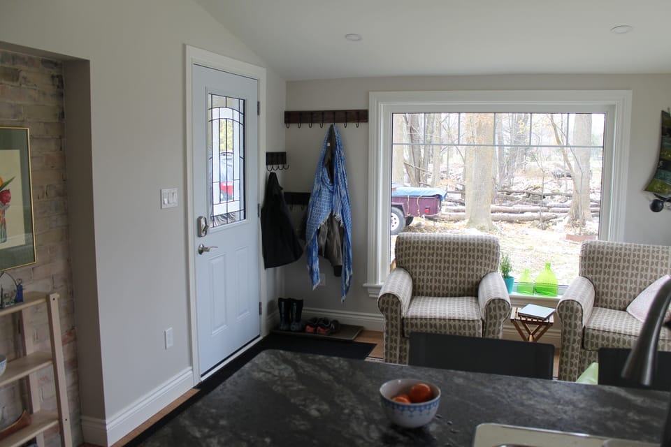 Enter into the kitchen/den and hang your coats up on the hooks