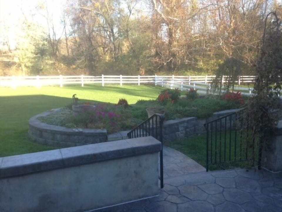 Fenced in back yard and 
flower garden from the back patio