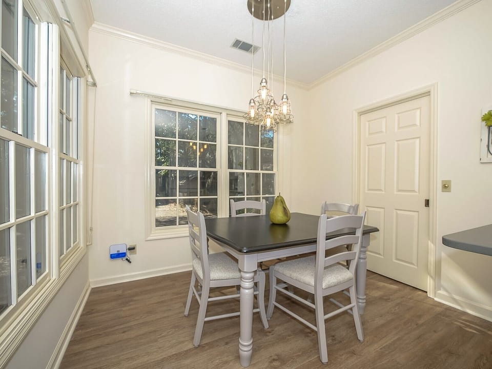 Kitchen Table Seats Four and Connects to Laundry Room at 2 Pine Court