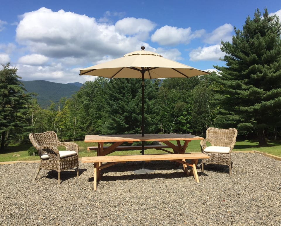 View of our patio in summer with mountain views.