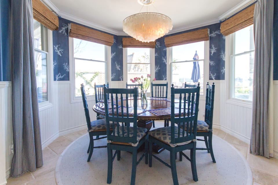 Kitchen dining seating 8 with view of the pool