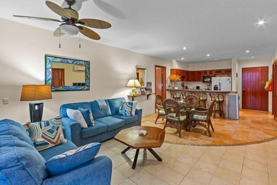 Living room has a couch and ocean views