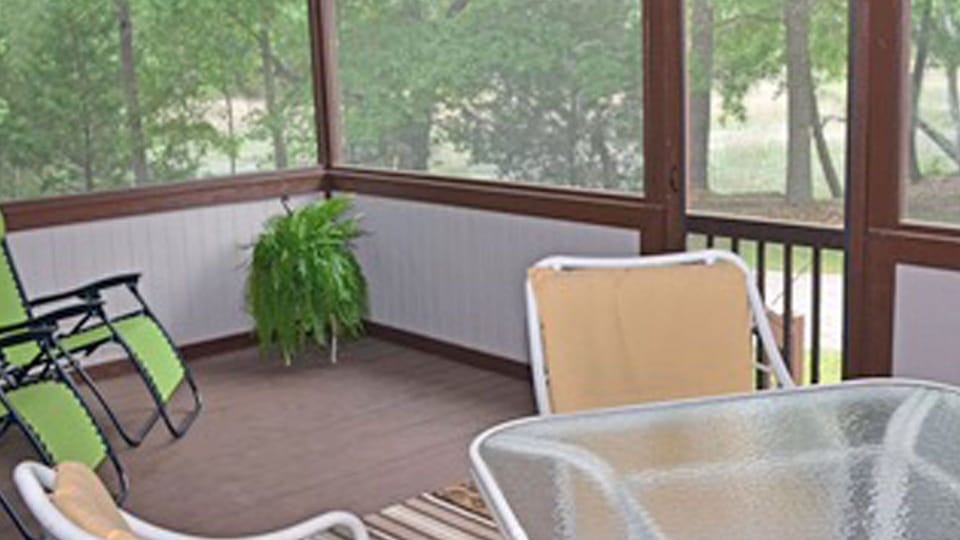 screen back porch overlooking marsh