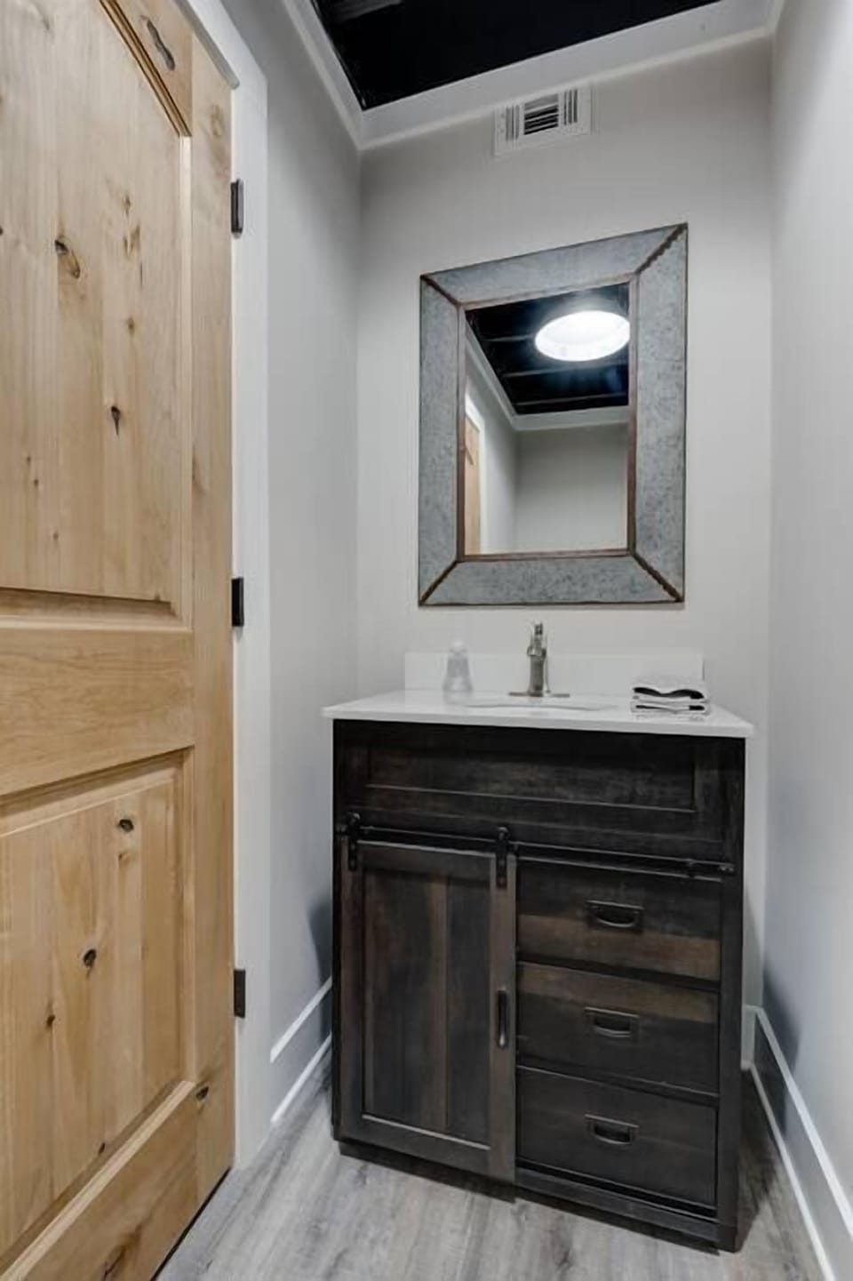 Downstairs half bath with easy lake access.