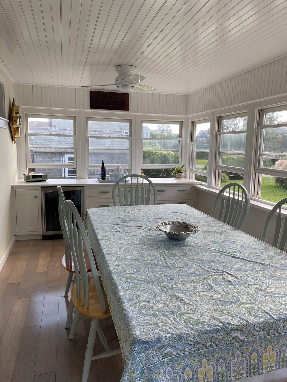 Light and airy dining room with new cabinets & beverage refrigerator 