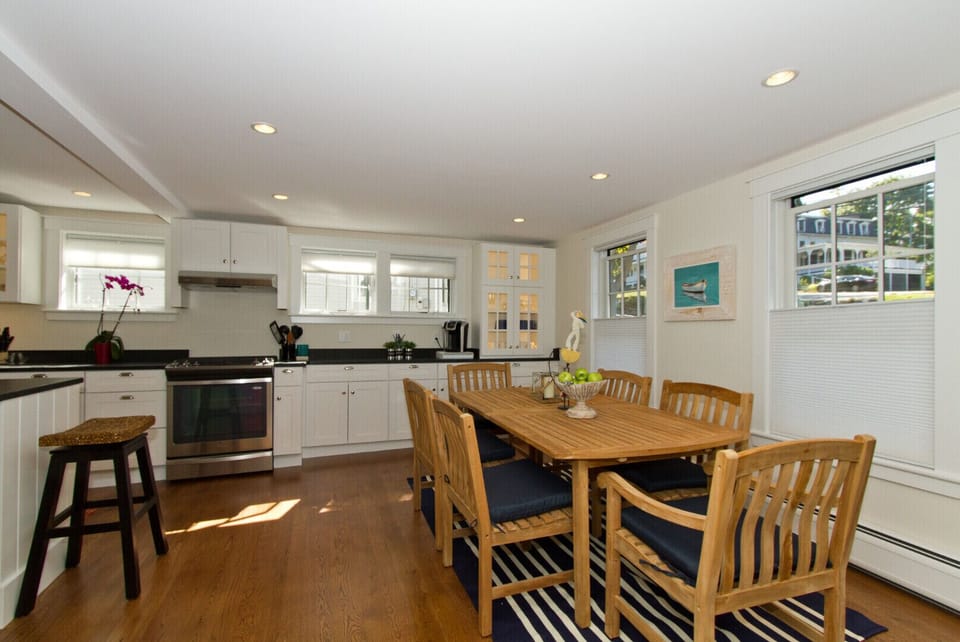 Teak dining room with seating for 6. Open kitchen and dining areas.  Great flow.