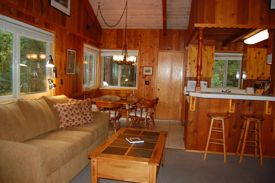 Living room with dining and kitchen area in background