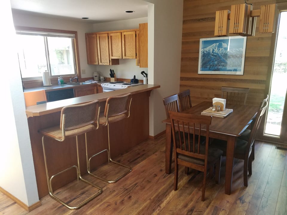 Quelah 70 dining area and partial view of kitchen