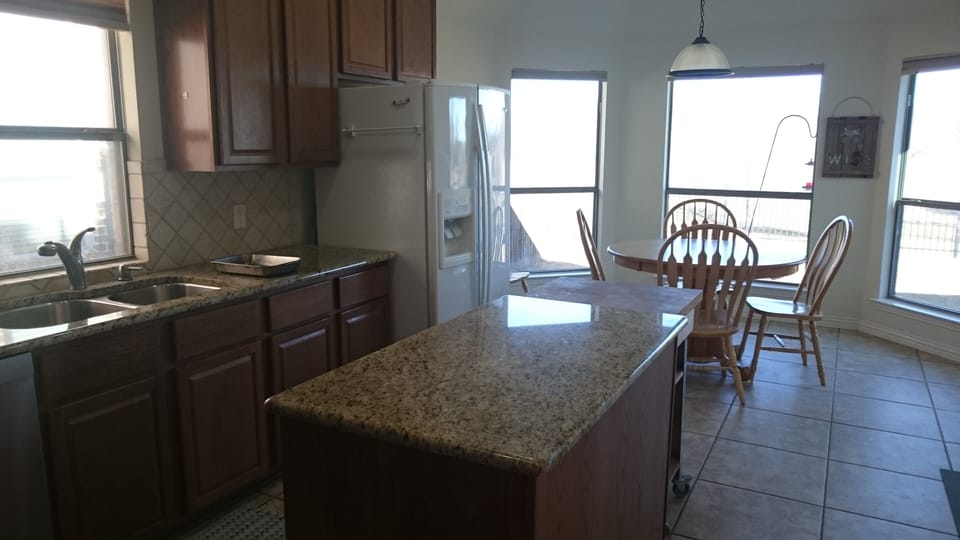 Gorgeous view into the backyard and beyond from the kitchen.