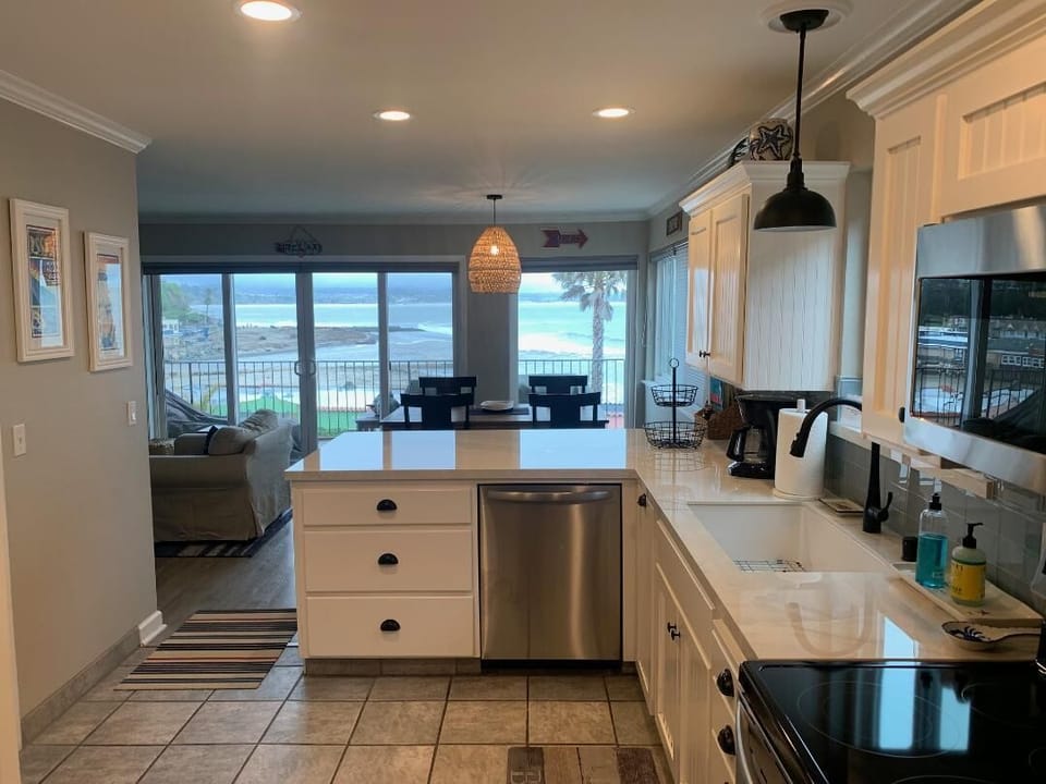 Kitchen with new countertop, backsplash and appliances. 