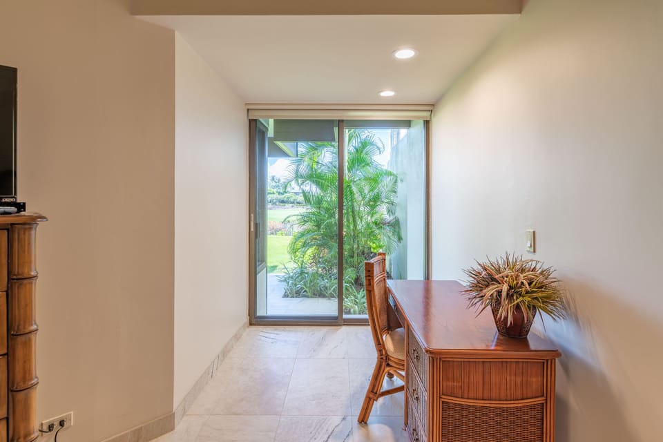 Enjoy the quiet of a work desk area in the master bedroom; easy access to the lanai.