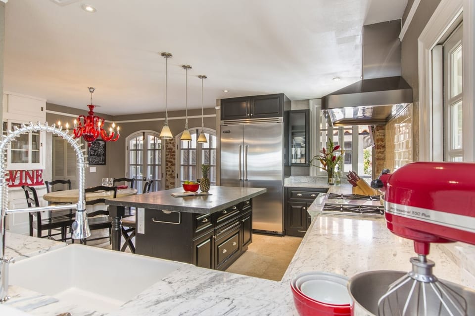 Entertain in style in the gourmet chef’s kitchen featuring marble counters, custom cabinetry, and premium appliances.