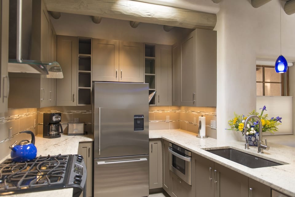 Custom kitchen with gas range, under counter microwave 
