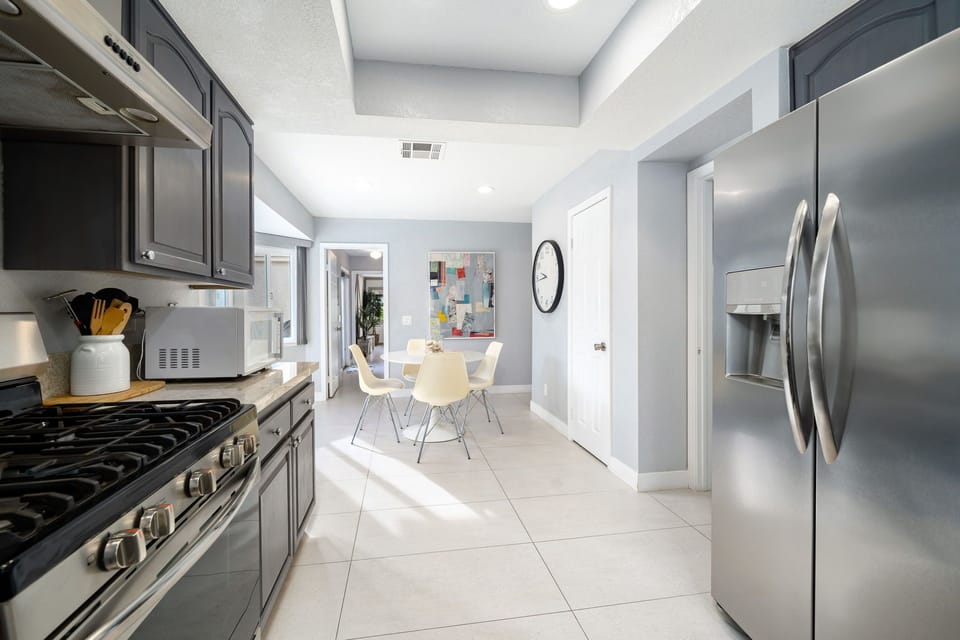 Kitchen looking to additional dining area.