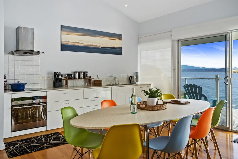 Colourful dining chairs - room for all guests at the table.