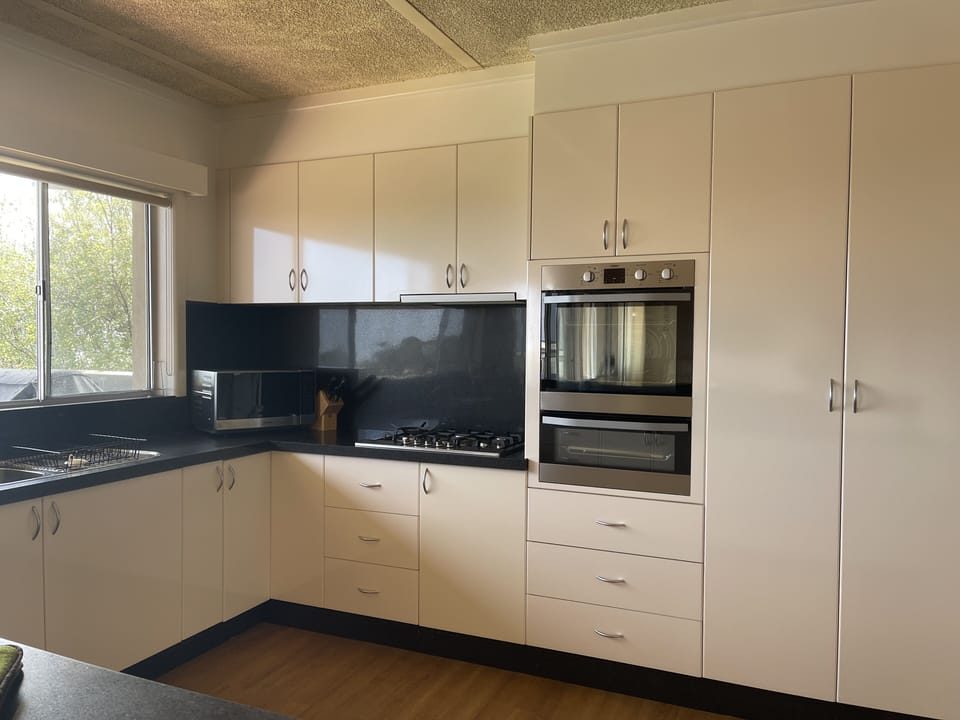 Kitchen:
No dishwasher, oven, grill, 5 burner gas stovetop, microwave.