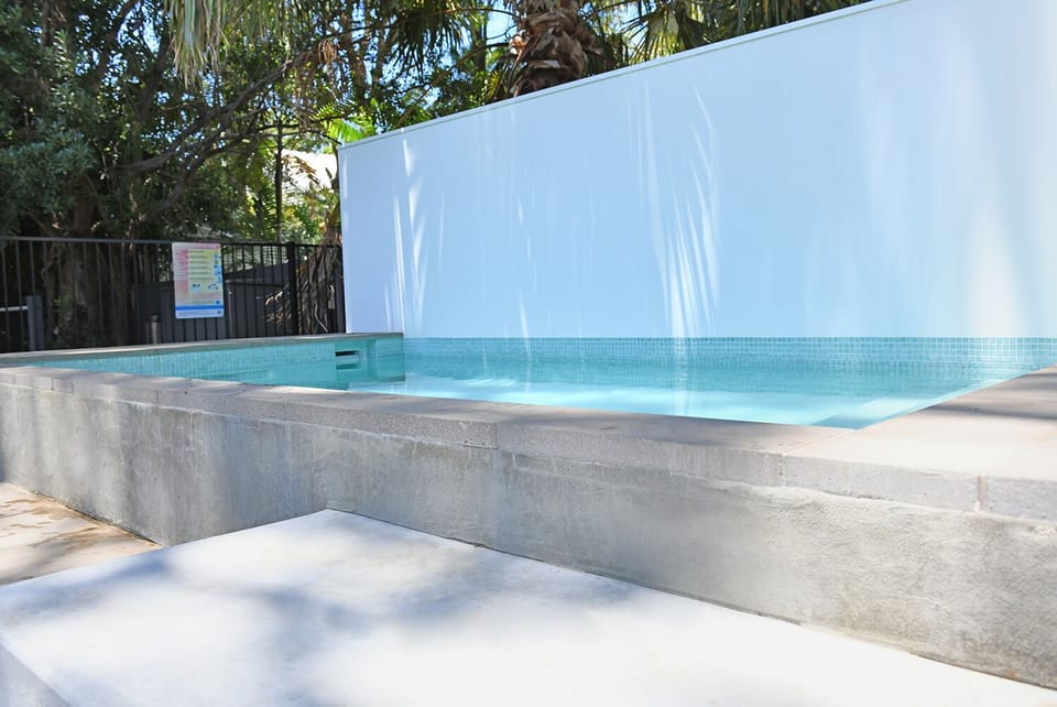 Heated pool with swim jet