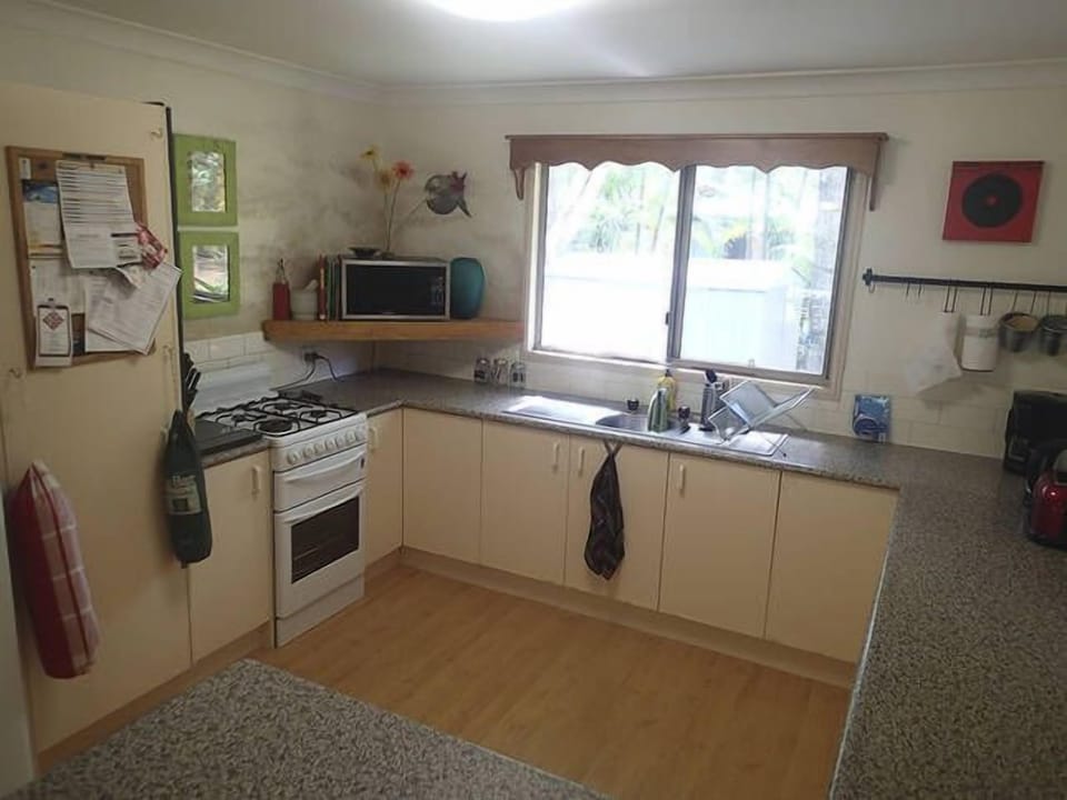 Large kitchen stocked with all handy appliances you need.