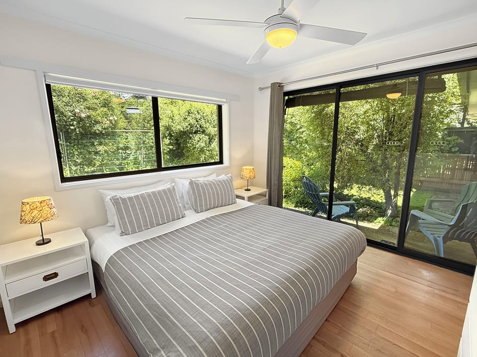 Main bedroom with king bed and private garden outlook.
Premium quality linen