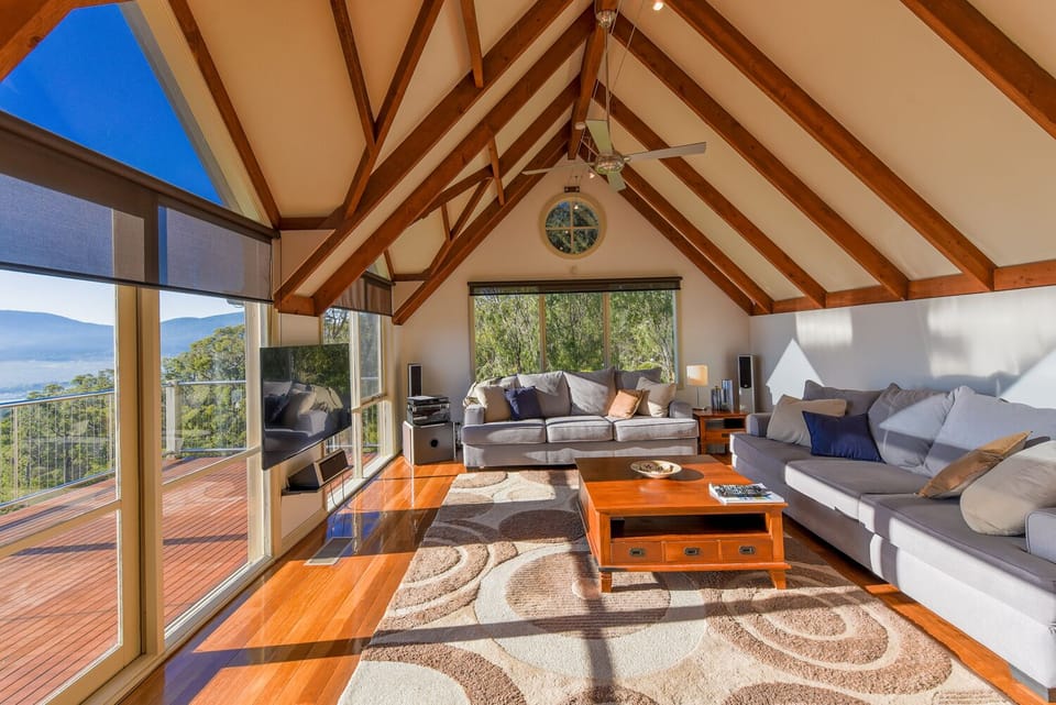 Lounge room with 2 large 3 seater lounges and Sonos sound system
