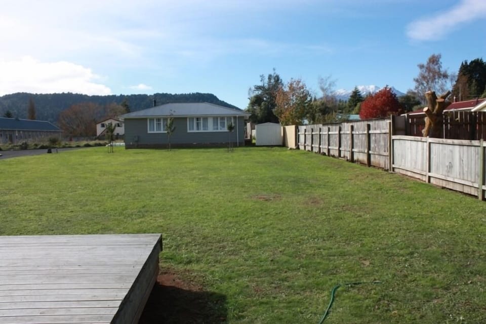 Deck, large flat lawn and view of Mt Ruapehu