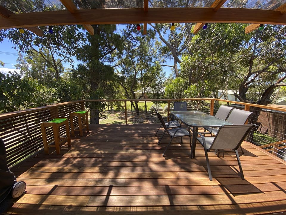 Big shady upstairs deck with bar seating and outdoor dining