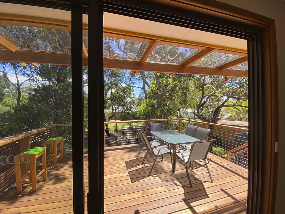 Dining area opens to the big deck with BBQ