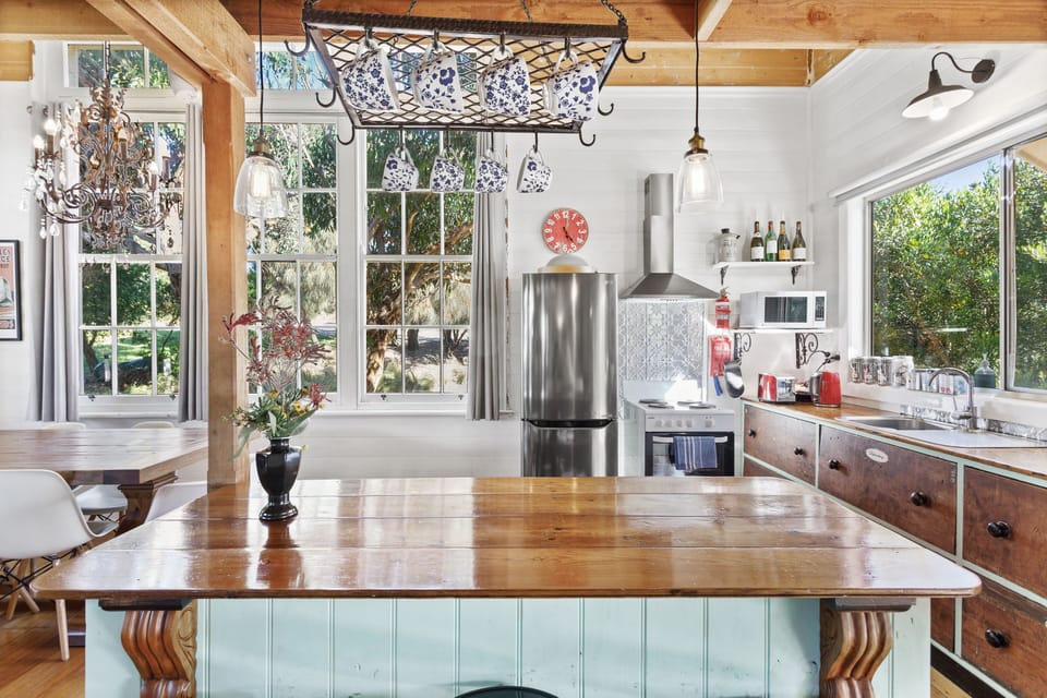 The kitchen includes a full size fridge and freezer