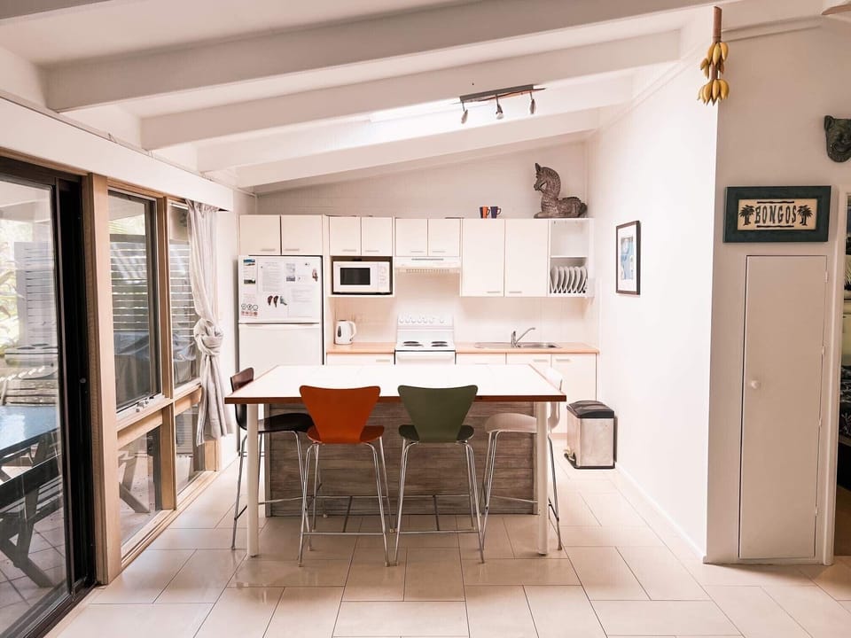 The kitchen has plenty of room to sit around the island bench.