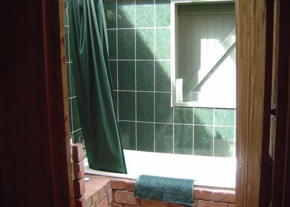 Bathroom, with shutter opening to bush