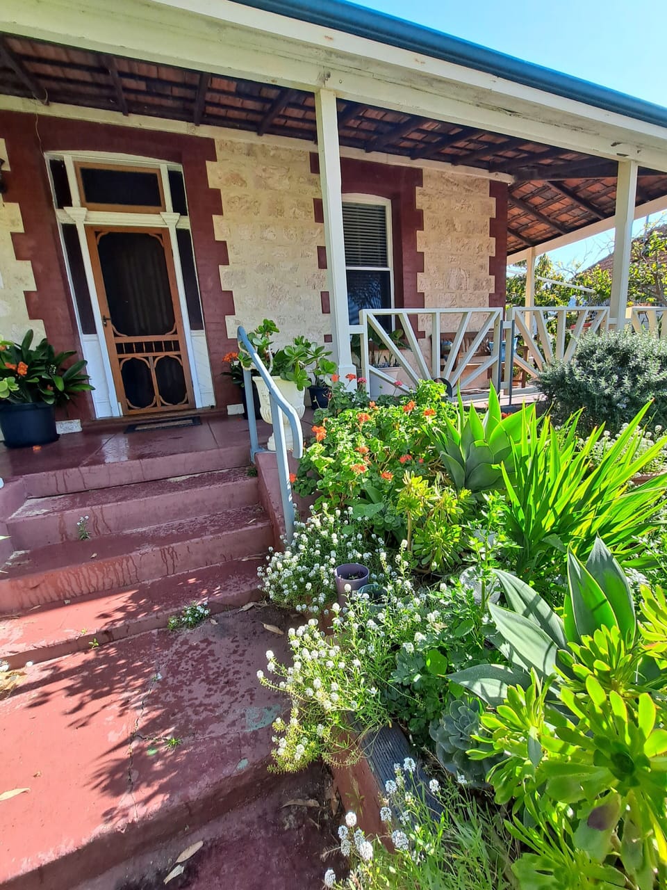 Front entry showing new hand rail on the steps.