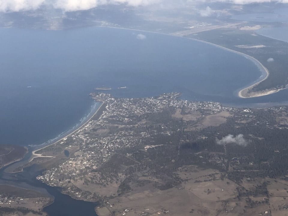 House is near top end of the beach on the Left side of photo. 