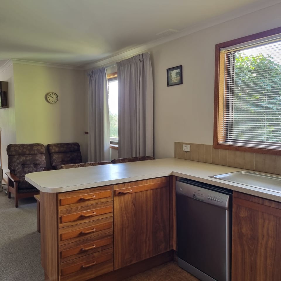 Kitchen showing dishwasher, drawers and reading nook