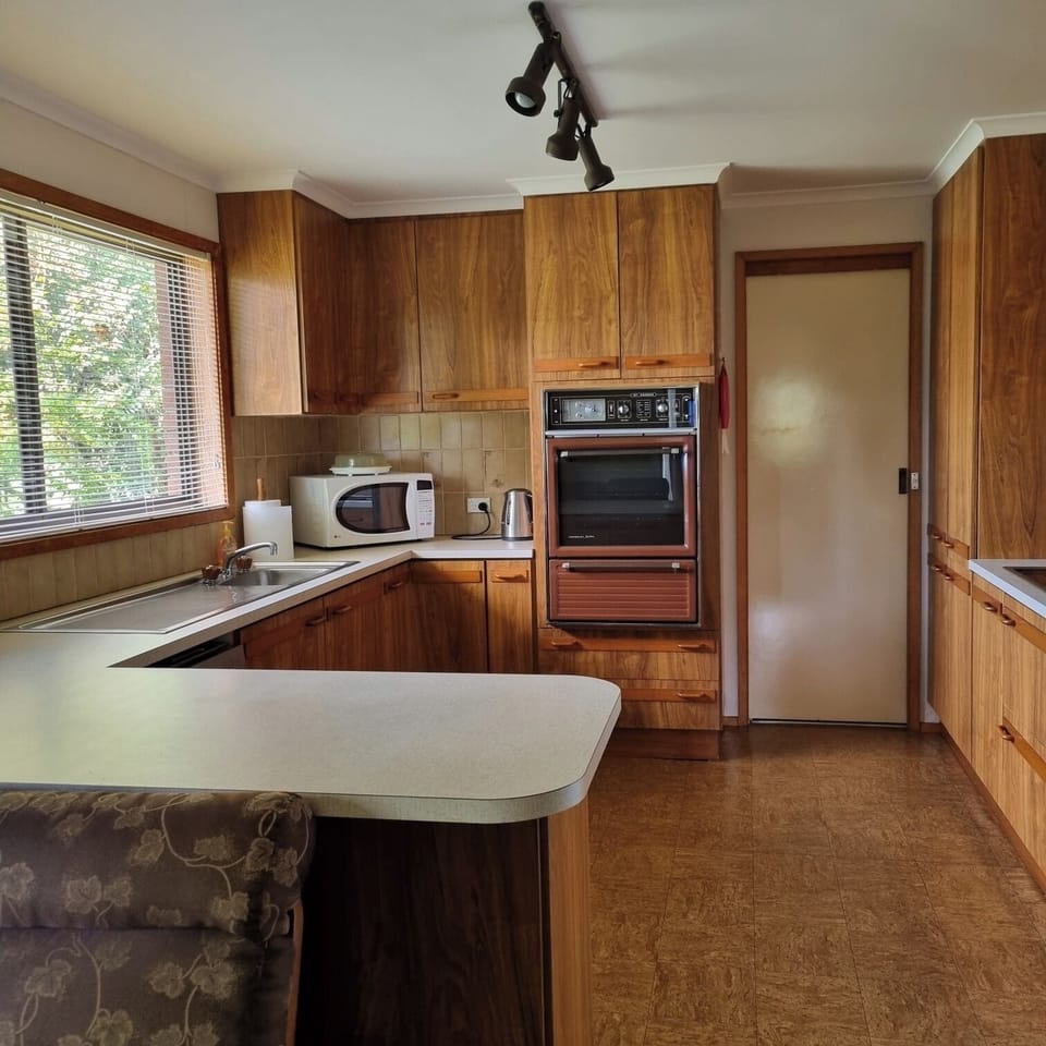 Kitchen,  showing sliding door to laundry 
