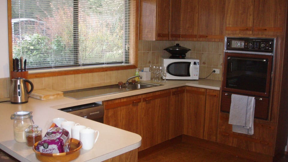 Kitchen showing microwave, wall oven, Dishwasher.