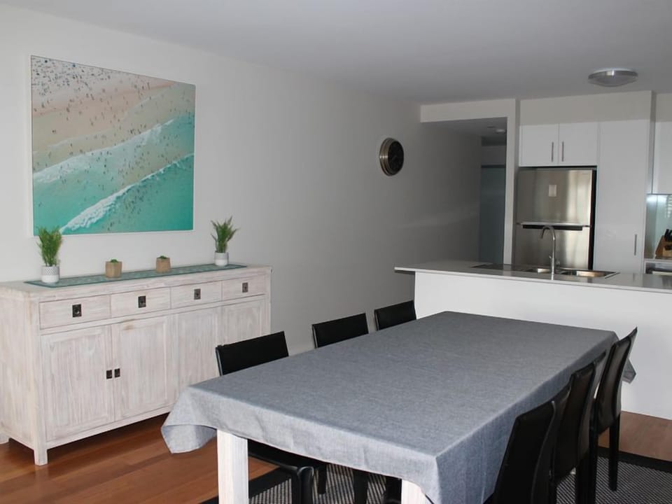 Dining area, kitchen background.