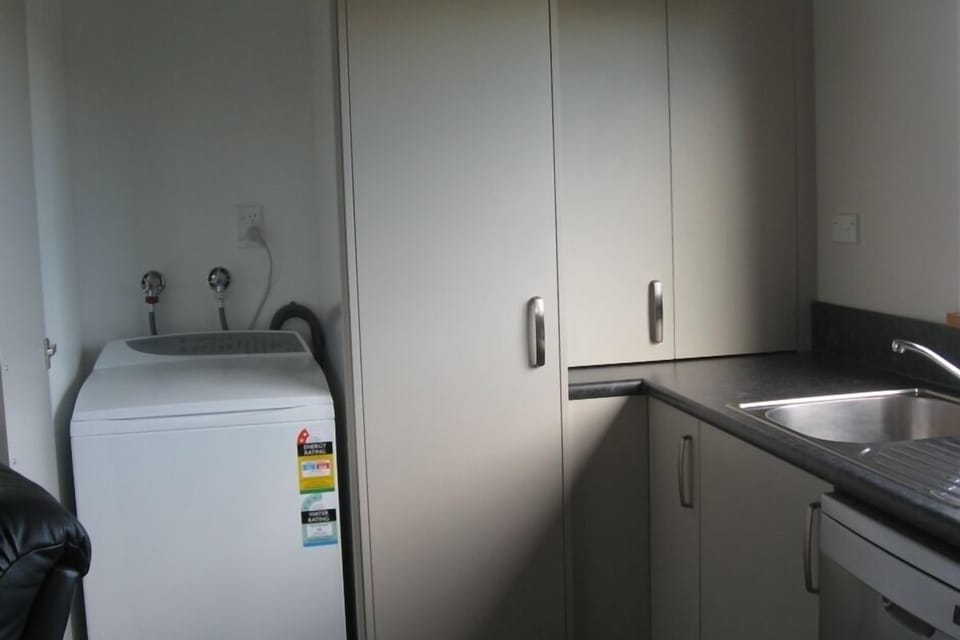 Washing machine in kitchen area