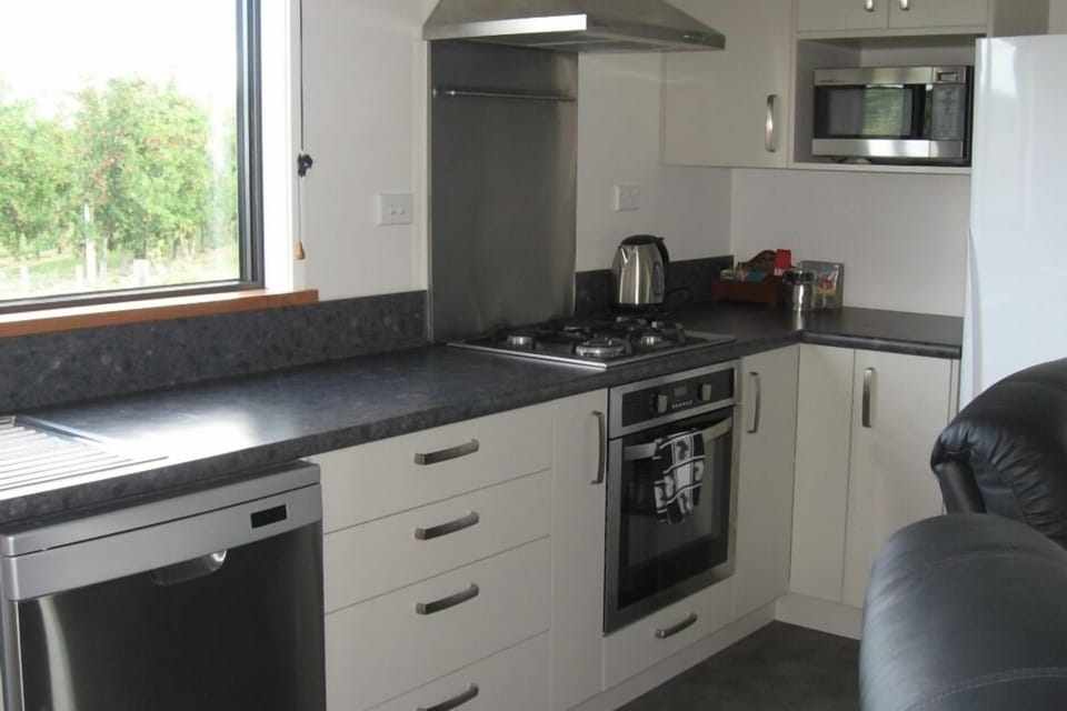 Kitchen with view of next door orchard